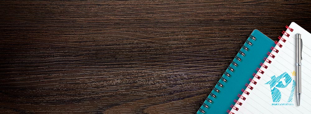Woodgrain background with a teal spiral notebook and an open lined notebook topped with a silver pen. White text reads 'Tips for Tackling College Application Essays.' Below, a blue button says 'Click for FAFSA Help,' with The HomeScholar logo faintly visible on the notebook page.